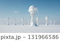 Multiple snow-covered power line towers stand in a vast, white winter landscape under a clear blue sky, displaying heavy ice formations on their structures. 131966586