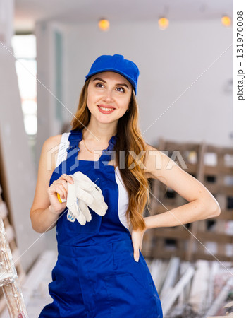 Portrait of a young seductive woman engineer in uniform 131970008