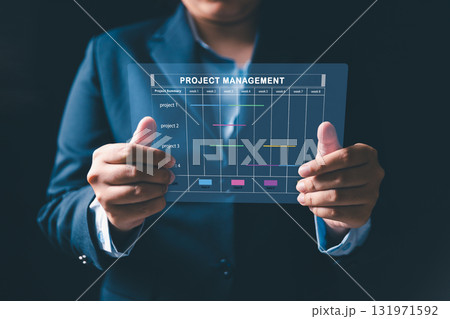 Project manager is working on virtual screen, using project management system. Gantt chart interface to plan tasks, schedule milestones, track progress, ensuring efficient project execution company. 131971592