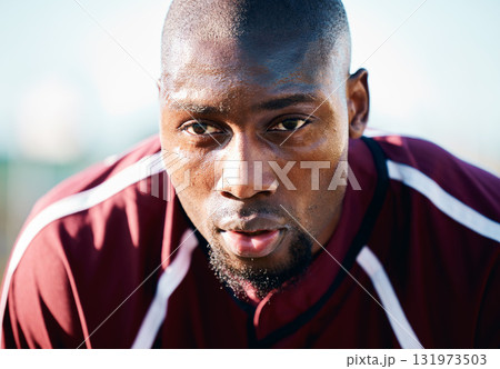 Breathing, focus and black man in sports training, competition or game on rugby field and blue sky. Breathe, sweating and tired athlete or person thinking of workout, exercise or fitness strategy 131973503