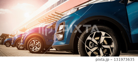 Blue business car with shiny front lights color bright 131973635