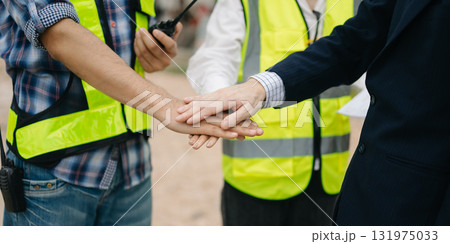 Asian Engineer and contractor join hands after signing contract,They are having a modern building project together. Asian Engineer and contractor join hands after signing contract,They are having a modern building project together. 131975033