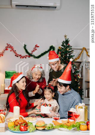 Celebrate Christmas with family in a cozy, festive setting filled with gifts, love, and joy. Celebrate Christmas with family in a cozy, festive setting filled with gifts, love, and joy. 131975518