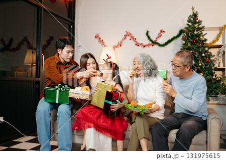 Celebrate Christmas with family in a cozy, festive setting filled with gifts, love, and joy. Capture the spirit of holiday Celebrate Christmas with family in a cozy, festive setting filled with gifts, love, and joy. Capture the spirit of holiday 131975615