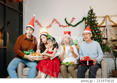 Celebrate Christmas with family in a cozy, festive setting filled with gifts, love, and joy. Capture the spirit of holiday Celebrate Christmas with family in a cozy, festive setting filled with gifts, love, and joy. Capture the spirit of holiday 131975618