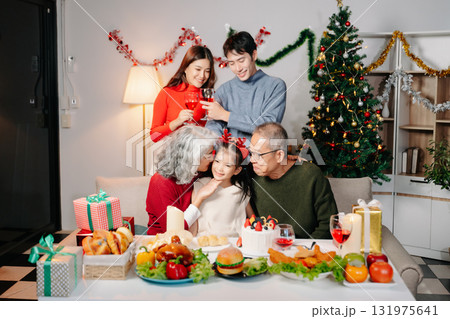 Celebrate Christmas with family in a cozy, festive setting filled with gifts, love, and joy. Celebrate Christmas with family in a cozy, festive setting filled with gifts, love, and joy. 131975641