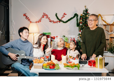 Celebrate Christmas with family in a cozy, festive setting filled with gifts, love, and joy. Celebrate Christmas with family in a cozy, festive setting filled with gifts, love, and joy. 131975644
