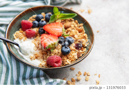 Granola bowl with fresh berries for healthy breakfast Granola bowl with fresh berries for healthy breakfast 131976033