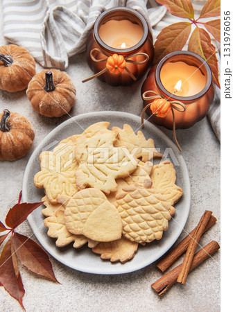 Autumn cookies on plate with cinnamon and fall decor Autumn cookies on plate with cinnamon and fall decor 131976056