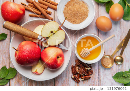 Baking ingredients for apple dessert on wooden table Baking ingredients for apple dessert on wooden table 131976061