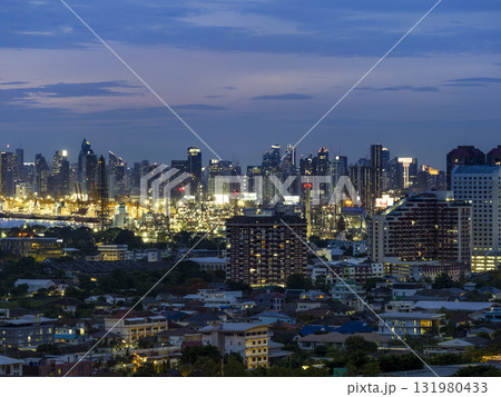 タイ・バンコク高層ビル群とチャオプラヤー川沿い工場地帯 夜景 / Bangkok. Thailand 131980433
