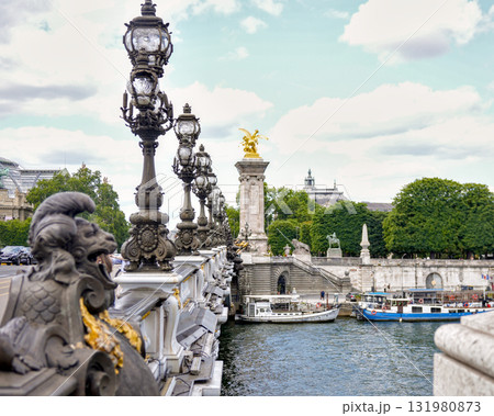 Historic ornate bridge with decorative lamps in Paris, France Historic ornate bridge with decorative lamps in Paris, France 131980873