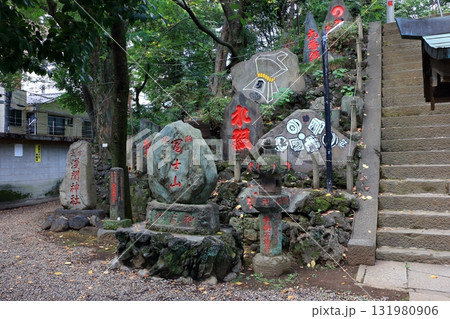 Komagome Fuji Jinja in Bunkyo-ku Tokyo Japan is a Shinto Shrine on a manmade hill called a Fujizaka using rocks from Mt. Fuji, founded around 1573 and dedicated to Japanese firefighters.  131980906