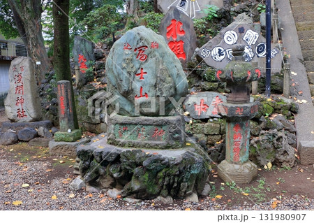Komagome Fuji Jinja in Bunkyo-ku Tokyo Japan is a Shinto Shrine on a manmade hill called a Fujizaka using rocks from Mt. Fuji, founded around 1573 and dedicated to Japanese firefighters.  131980907