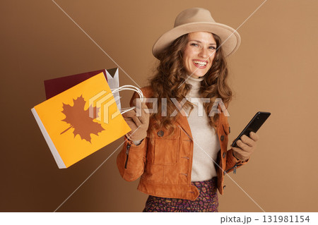 Smiling Woman in Autumn Fashion with Shopping Smiling Woman in Autumn Fashion with Shopping 131981154