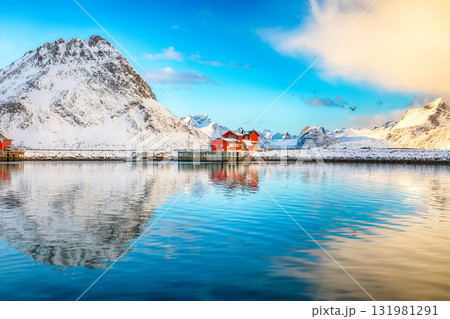 Astonishing morning view of small fishing village Ramberg at sunrise. Astonishing morning view of small fishing village Ramberg at sunrise. 131981291