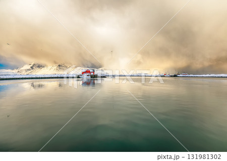 Amazing morning view of small fishing village Ramberg at sunrise. Amazing morning view of small fishing village Ramberg at sunrise. 131981302