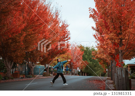 Enjoy a Cheerful Autumn Stroll Amidst the Vibrant Orange Leaves Everywhere 131981331