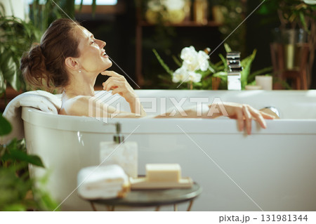 Tranquil Bath Moment with Eyes Closed Tranquil Bath Moment with Eyes Closed 131981344