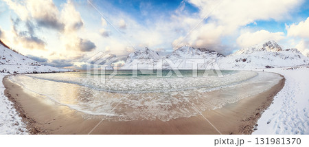 Amazing winter view of Vik beach during sunset with lots of snow and snowy mountain peaks near Leknes. Amazing winter view of Vik beach during sunset with lots of snow and snowy mountain peaks near Leknes. 131981370