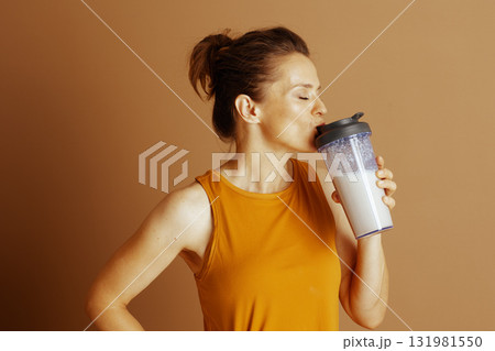 Content Woman Savoring a Refreshing Protein Shake 131981550