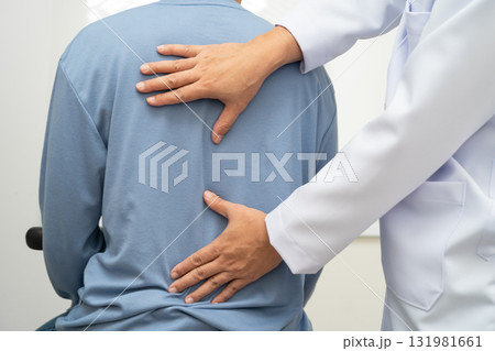 Physical therapy, Asian therapist doctor treat perform pain young man in hospital. Physical therapy, Asian therapist doctor treat perform pain young man in hospital. 131981661