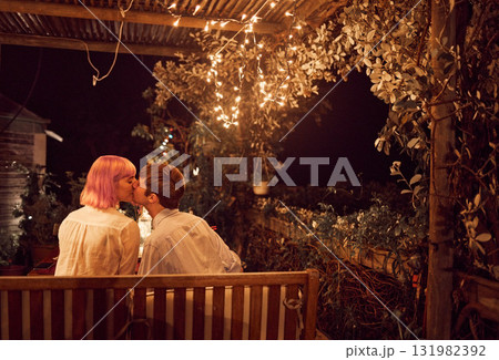 Love, kiss and night with couple in restaurant for date, romance or affectionate in garden. Celebration, anniversary and valentines day with man and woman in bonding for passionate, flirt or dinner Love, kiss and night with couple in restaurant for date, romance or affectionate in garden. Celebration, anniversary and valentines day with man and woman in bonding for passionate, flirt or dinner 131982392