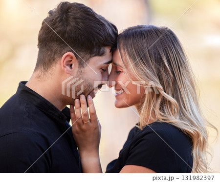 Forehead, love and couple with real marriage, relationship and smile on date, loving and bonding together. Romance, man and woman with happiness and cheerful outdoor, celebrate and Valentines day Forehead, love and couple with real marriage, relationship and smile on date, loving and bonding together. Romance, man and woman with happiness and cheerful outdoor, celebrate and Valentines day 131982397