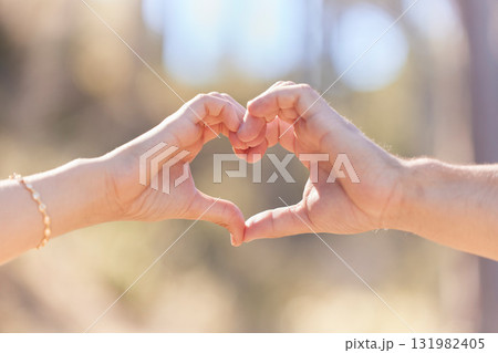 Heart hands, nature and love, support and commitment partnership for marriage outdoors. Valentines day, romance and couple, man and woman with emoji for care, relationship and affection or trust. Heart hands, nature and love, support and commitment partnership for marriage outdoors. Valentines day, romance and couple, man and woman with emoji for care, relationship and affection or trust. 131982405