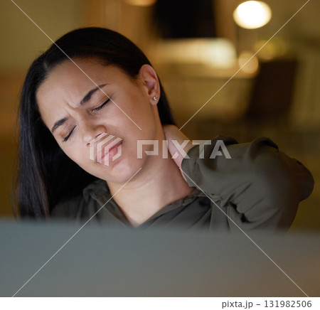 Night, business and woman with neck pain, burnout and workaholic in modern office, stress and muscle tension. Dark, female employee or manager with strain, deadline or injury with joint and workplace 131982506