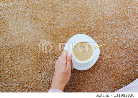 close-up. a cup of coffee on the beige Interior pile carpet. close-up. a cup of coffee on the beige Interior pile carpet. 131982630