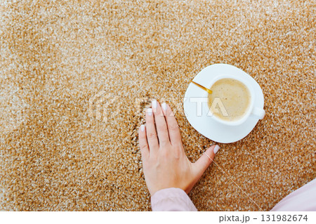 close-up. a cup of coffee on the beige Interior pile carpet. close-up. a cup of coffee on the beige Interior pile carpet. 131982674