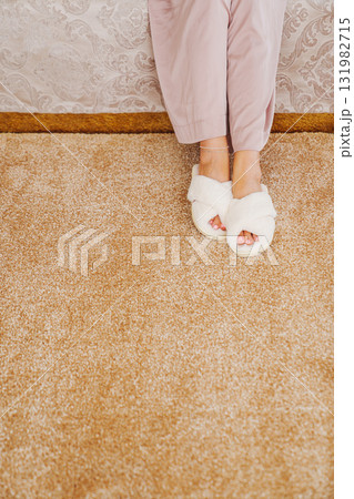soft white slippers on the beige Interior pile carpet. soft white slippers on the beige Interior pile carpet. 131982715
