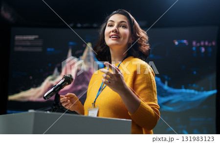 woman is giving a presentation at conference woman is giving a presentation at conference 131983123