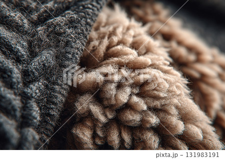 Close-up of dark and light animal wool products. The texture of the wool product. Close-up of dark and light animal wool products. The texture of the wool product. 131983191