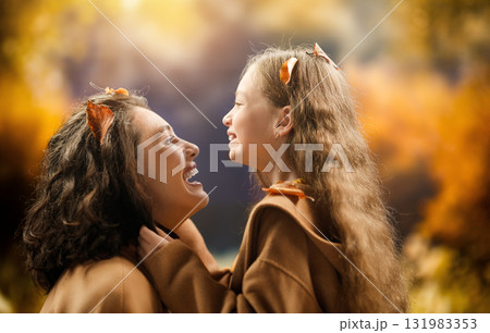 Mother and child daughter on autumn walk 131983353