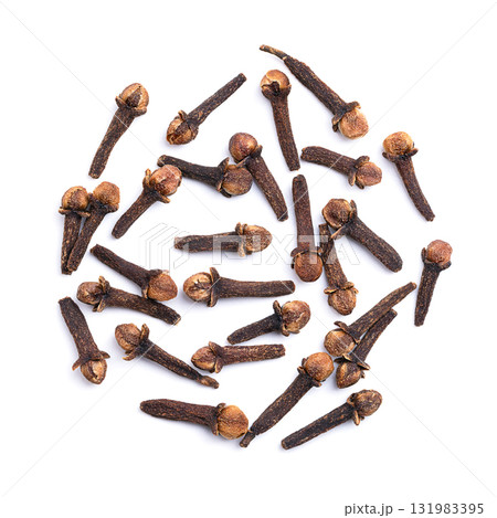 Dried cloves on white background. Bunch of aromatic flower buds of the tree Syzygium aromaticum, used as spice, flavoring, or fragrance, in cuisine, cosmetic products, etc. Close-up, from above. Photo Dried cloves on white background. Bunch of aromatic flower buds of the tree Syzygium aromaticum, used as spice, flavoring, or fragrance, in cuisine, cosmetic products, etc. Close-up, from above. Photo 131983395