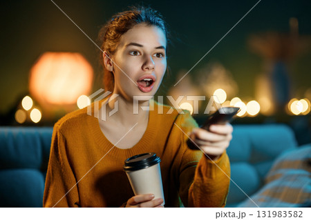 woman watching TV at home 131983582
