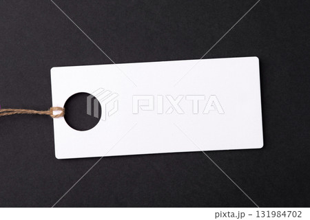 Empty white tag on black background 131984702