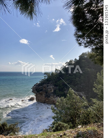 A small secluded lagoon among the rocks and a turbulent stormy sea Turkey Antalya A small secluded lagoon among the rocks and a turbulent stormy sea Turkey Antalya 131985345