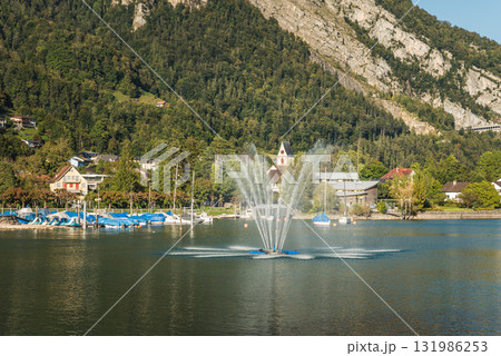 Harbor and fountain on Lake Walensee in Weesen, Canton of St. Gallen, Switzerland 131986253