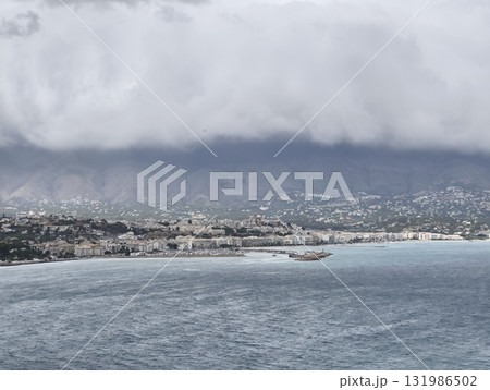Stunning Coastal View Featuring Dramatic Clouds Illuminating the Shorelines Beauty Stunning Coastal View Featuring Dramatic Clouds Illuminating the Shorelines Beauty 131986502