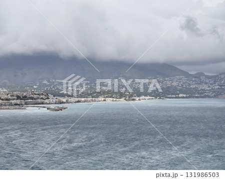 A Beautiful and Serene Coastal View Showcasing Various Cloudy Skies Over the Oceans Surface A Beautiful and Serene Coastal View Showcasing Various Cloudy Skies Over the Oceans Surface 131986503