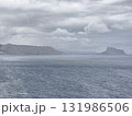 A Moody Coastal Landscape Featuring a Dramatic Sky and a Stunning Ocean View That Captivates 131986506