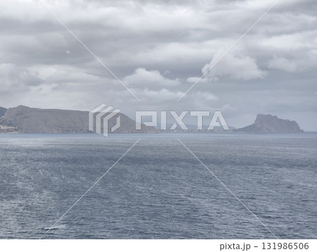 A Moody Coastal Landscape Featuring a Dramatic Sky and a Stunning Ocean View That Captivates 131986506