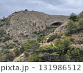 Breathtaking Scenic Mountain Landscape Featuring an Intriguing Cave Entrance Amidst Natures Beauty 131986512