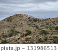 A breathtaking scenic view from a hilltop showcasing a dramatic stormy sky above 131986513