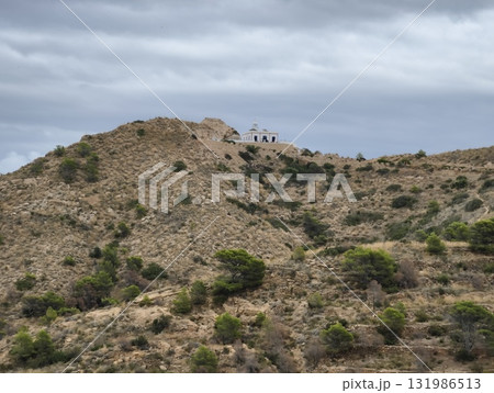 A breathtaking scenic view from a hilltop showcasing a dramatic stormy sky above 131986513