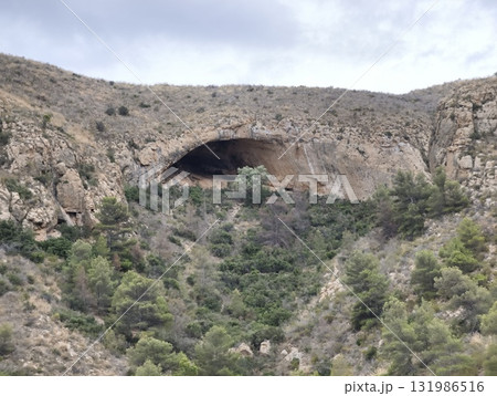 Explore the Majestic Natural Cave in the beautiful Rocky Landscape, perfect for adventurers 131986516