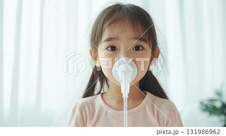Asian little girl sick and doing inhalation in house Asian little girl sick and doing inhalation in house 131986962